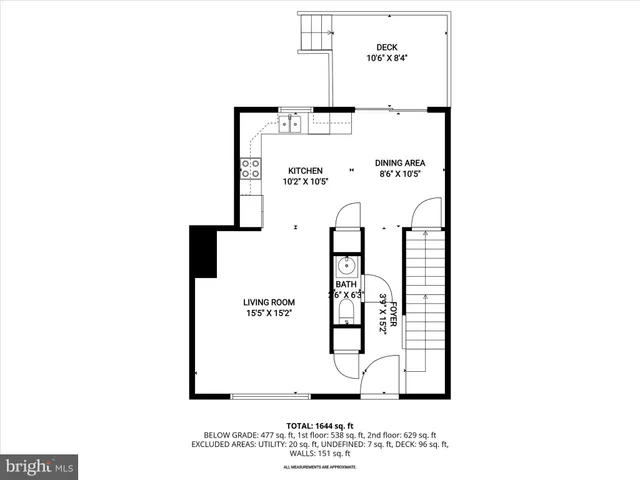 a picture of a bench in front of a wall