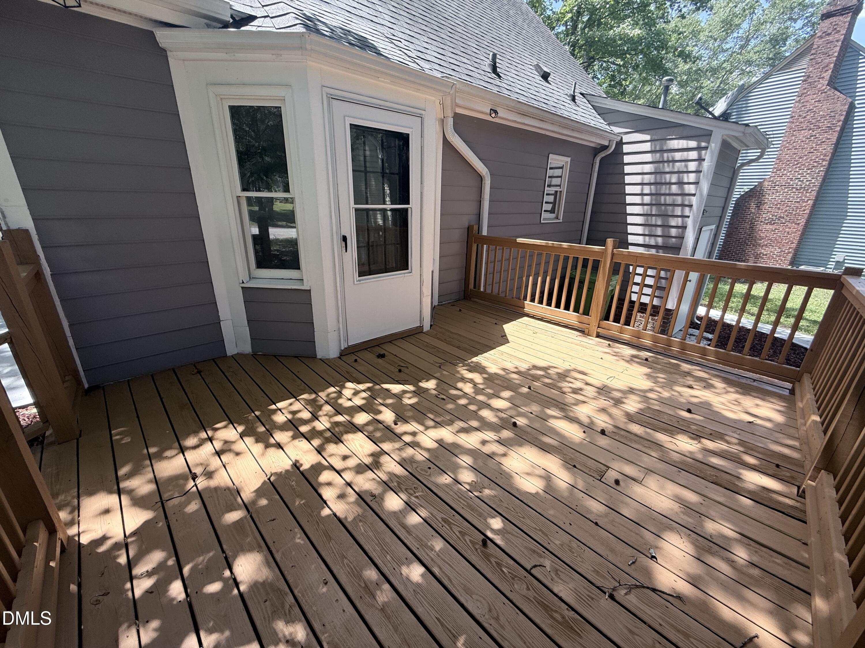 2900 Broadlands Drive Raleigh, NC 27604 - Photo 15 of 60 a view of a house with deck and wooden floor