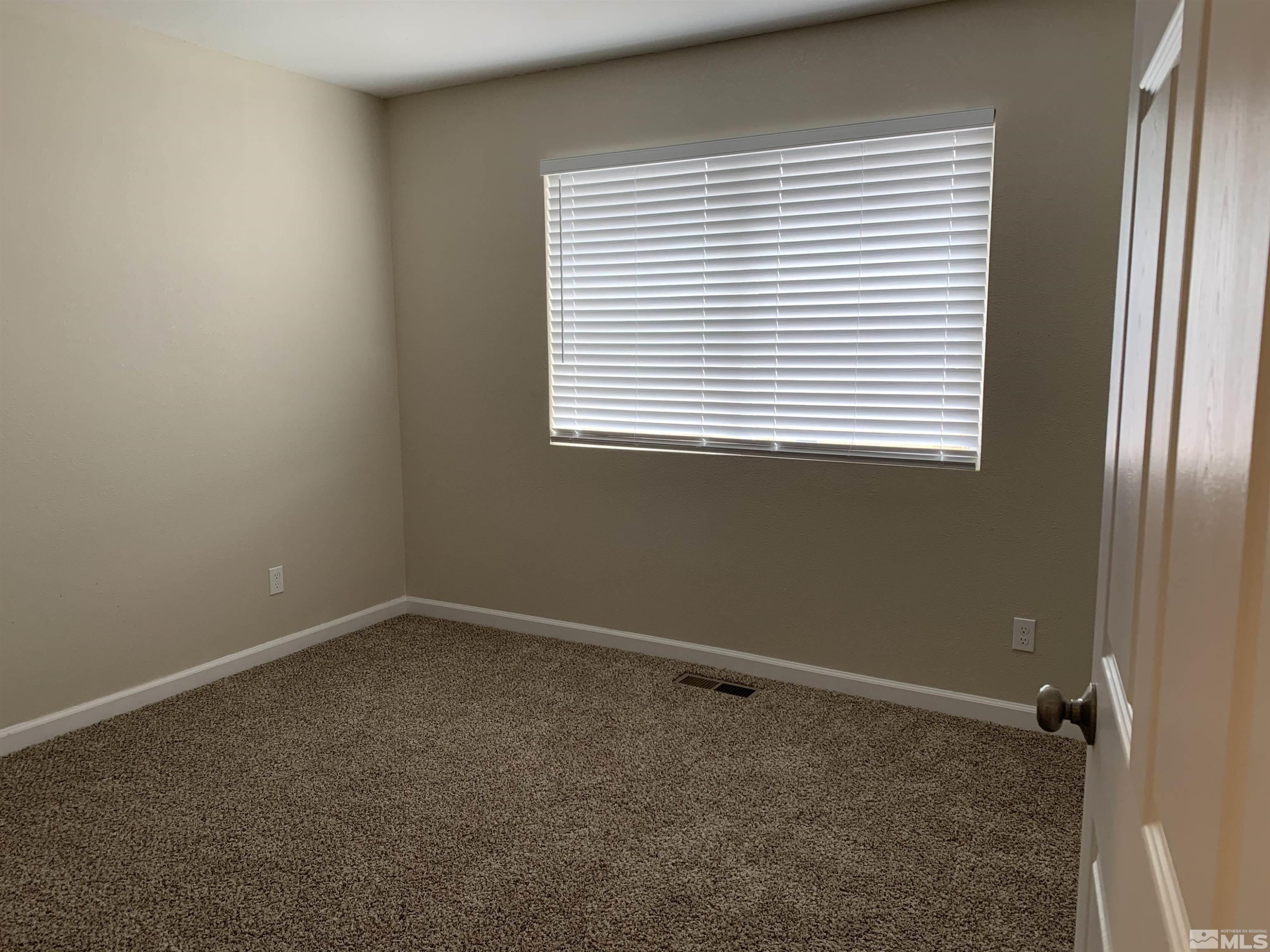 2150 Sutro Street, Unit A3 Reno, NV 89512 - Photo 5 of 8 an empty room with a window