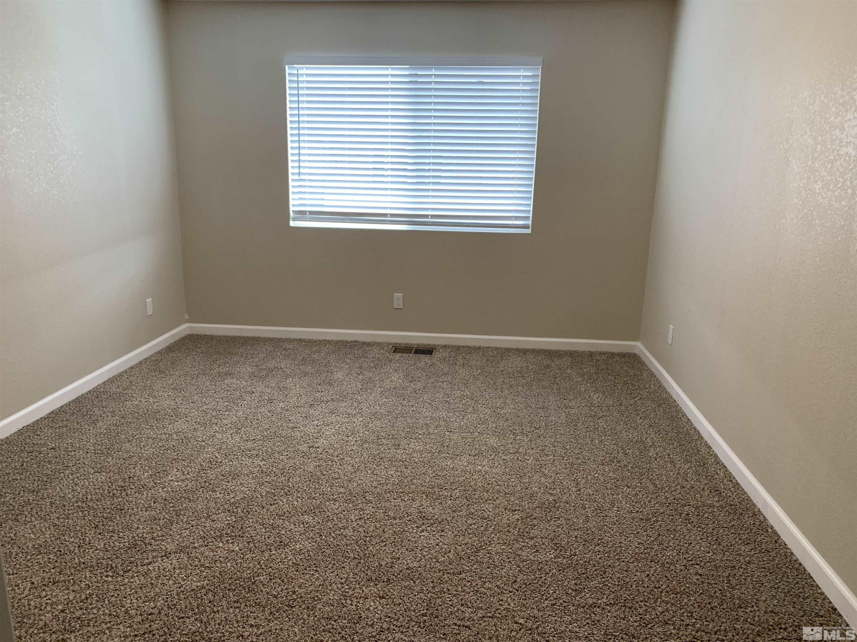 2150 Sutro Street, Unit A3 Reno, NV 89512 - Photo 6 of 8 an empty room with a window