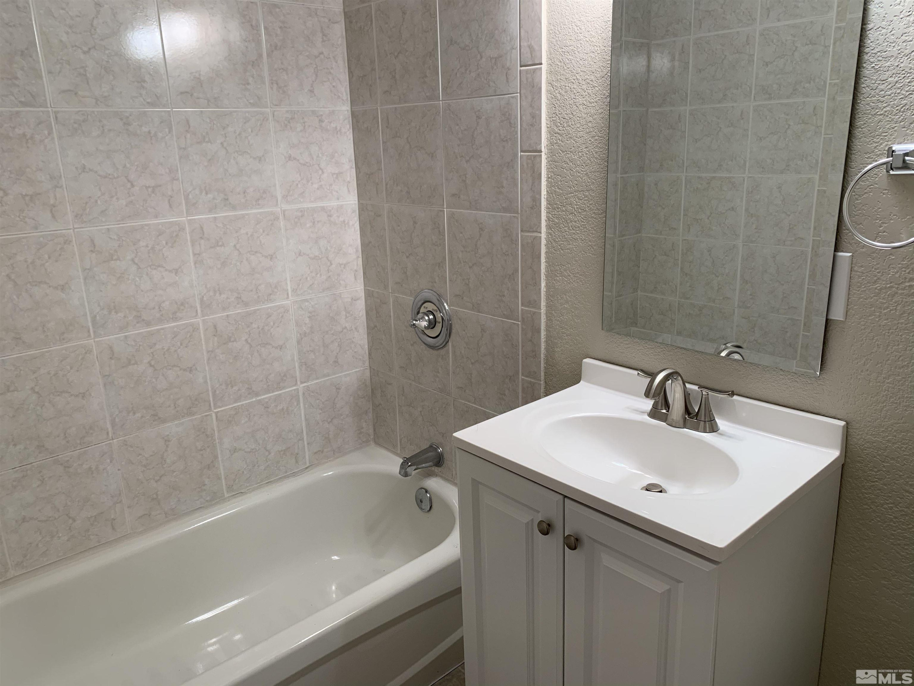 2150 Sutro Street, Unit A3 Reno, NV 89512 - Photo 8 of 8 a bathroom with a sink and a bathtub