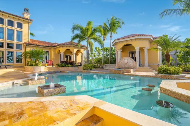 a living room with fireplace furniture and wooden floor