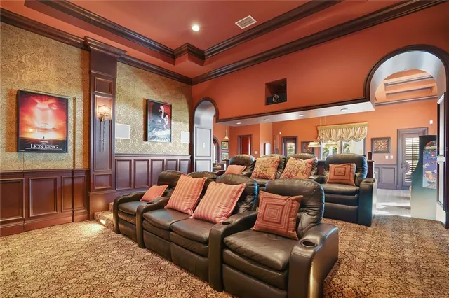 a bathroom with a granite countertop toilet sink and mirror