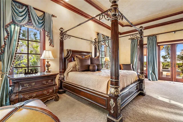 a bedroom with a large bed and a window