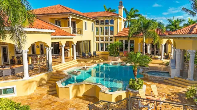 a view of a patio with table and chairs and potted plants
