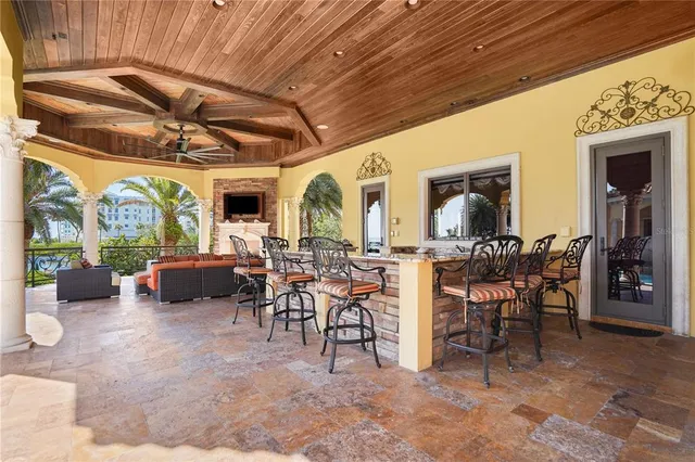 a view of a dining room with furniture and a chandelier