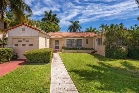 a view of a front of a house with a yard