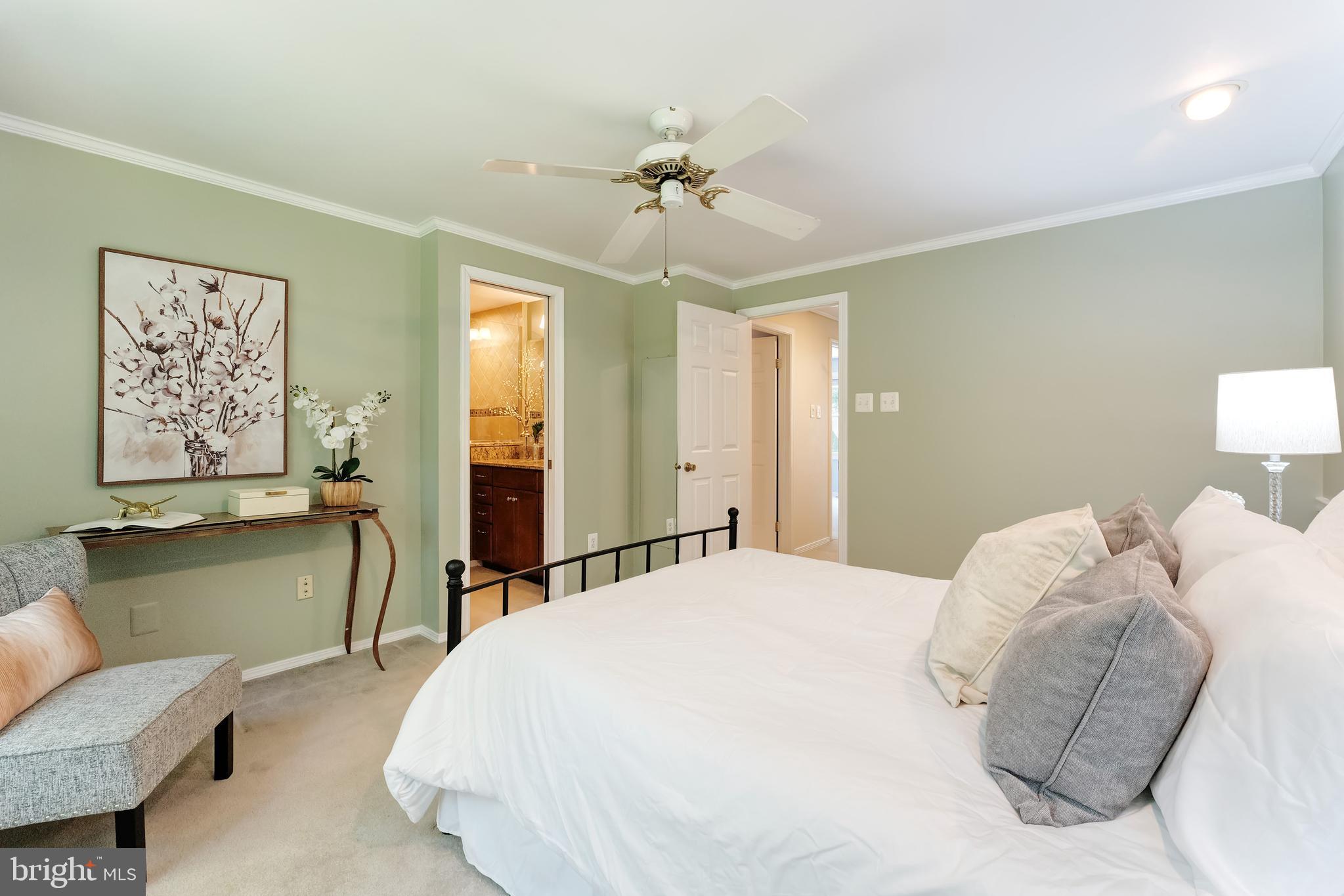 1512 Poplar Grove Drive Reston, VA 20194 - Photo 17 of 70 a bedroom with a bed and a chandelier