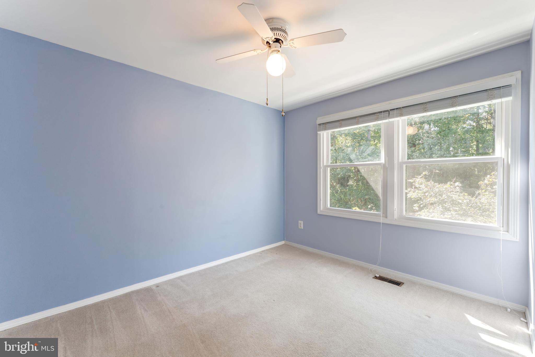 1512 Poplar Grove Drive Reston, VA 20194 - Photo 21 of 70 an empty room with a window and a fan