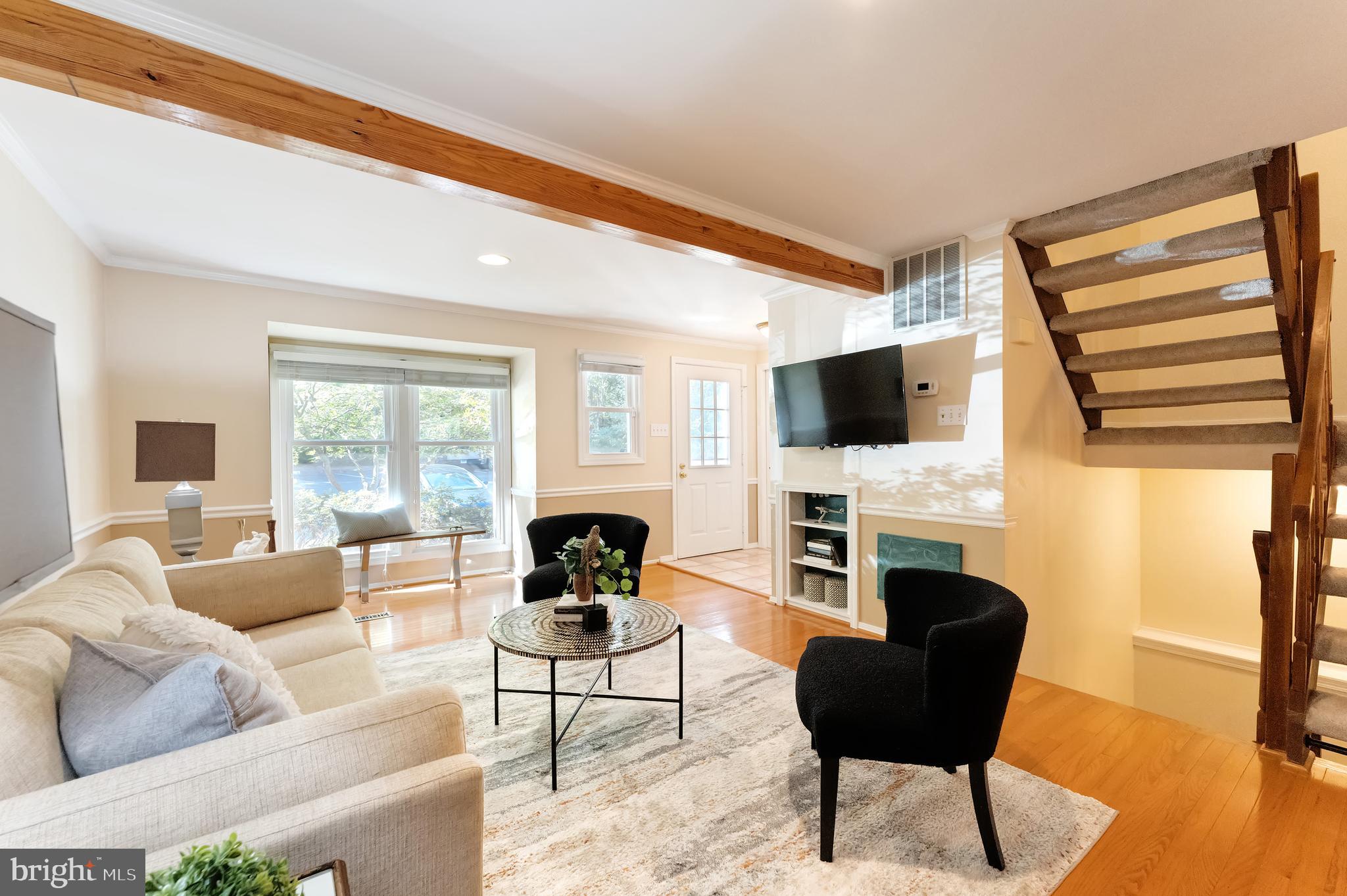 1512 Poplar Grove Drive Reston, VA 20194 - Photo 3 of 70 a living room with furniture a fireplace and a flat screen tv