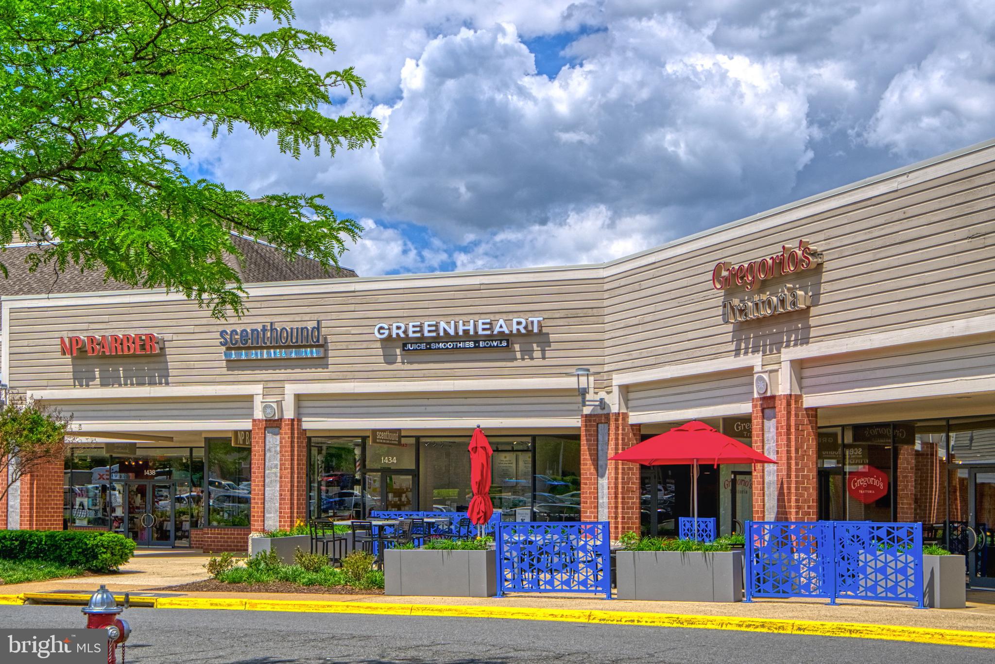 1512 Poplar Grove Drive Reston, VA 20194 - Photo 47 of 70 a view of a cafe with a table and chairs under an umbrella