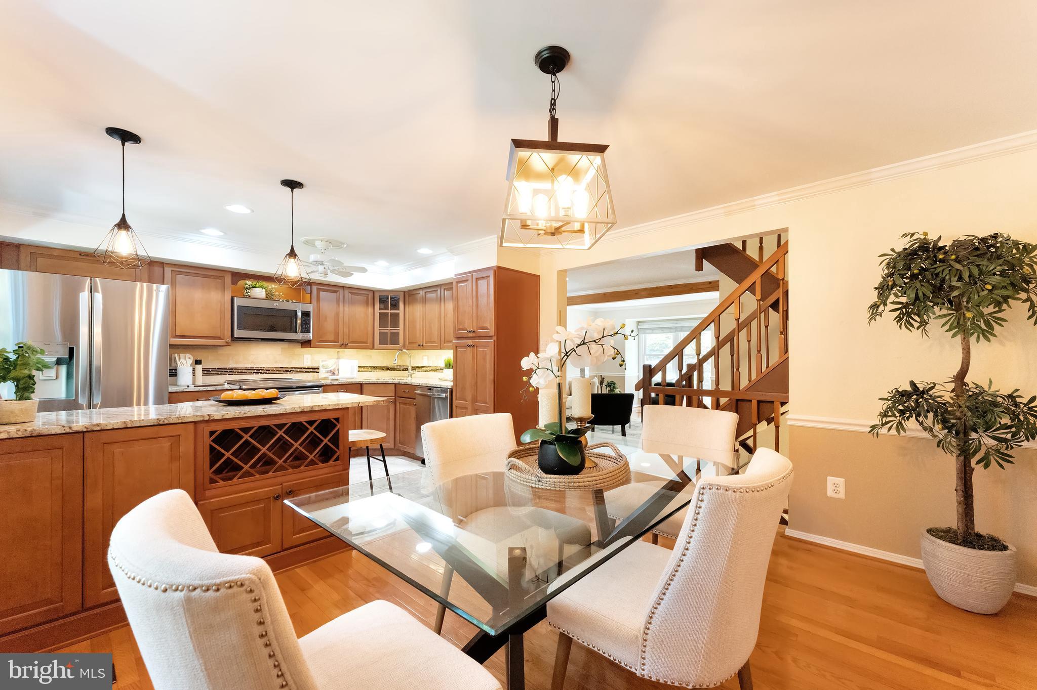 1512 Poplar Grove Drive Reston, VA 20194 - Photo 6 of 70 a dining room with furniture a chandelier and wooden floor