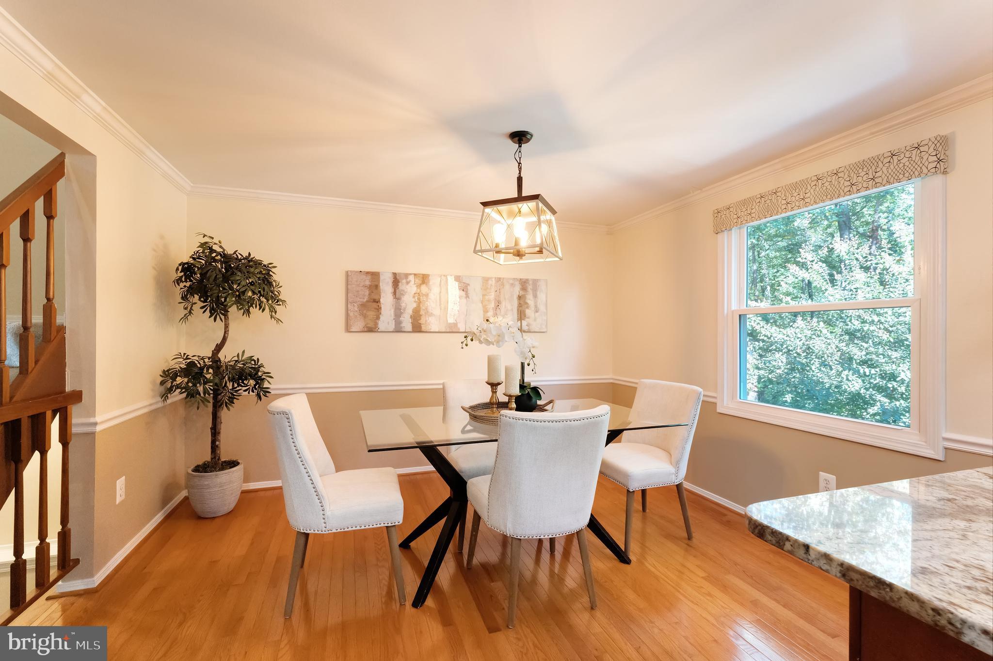 1512 Poplar Grove Drive Reston, VA 20194 - Photo 7 of 70 a dining room with furniture a chandelier and wooden floor