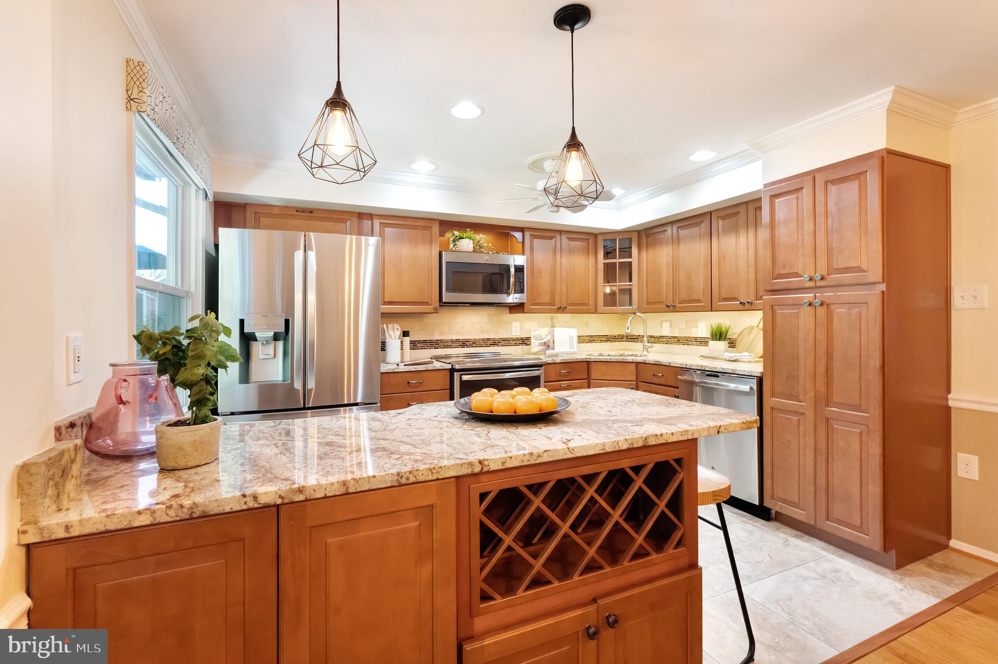 1512 Poplar Grove Drive Reston, VA 20194 - Photo 8 of 70 a kitchen with stainless steel appliances granite countertop a sink and a refrigerator