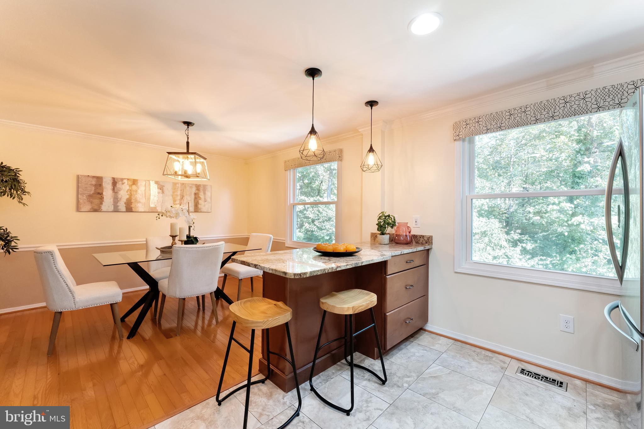 1512 Poplar Grove Drive Reston, VA 20194 - Photo 10 of 70 a dining room with furniture a chandelier and wooden floor