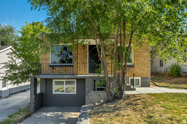 662 29th Street Ogden, UT 84403 - Photo 21 of 23 Brick exterior with a second-story balcony featuring black iron railings