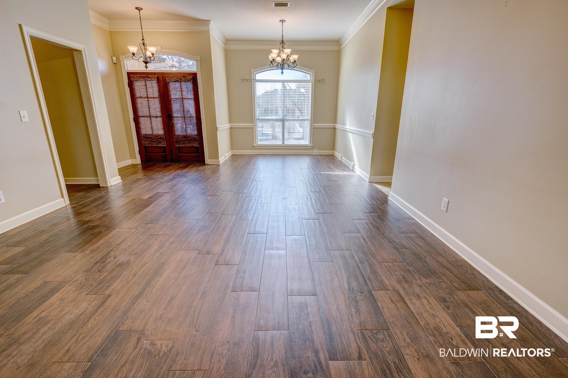 9421 Collier Loop Daphne, AL 36526 - Photo 7 of 31 Foyer entrance featuring french doors, a chandelier, ornamental molding, and dark wood-style floors