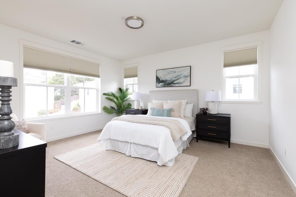 103 Staggi Lane Soquel, CA 95073 - Photo 16 of 35 a bedroom with a large bed and a window