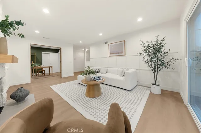 a living room with furniture and a table