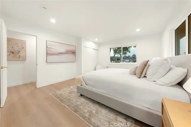 a large white bed in a white room