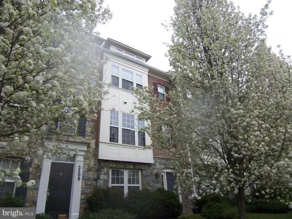 a view of a large white building with large windows