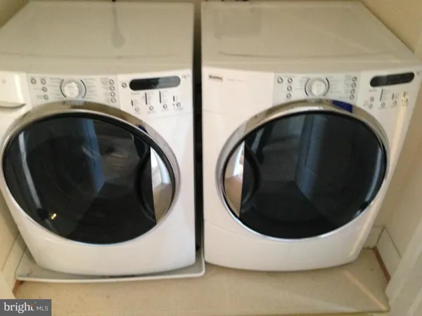 a utility room with dryer and washer