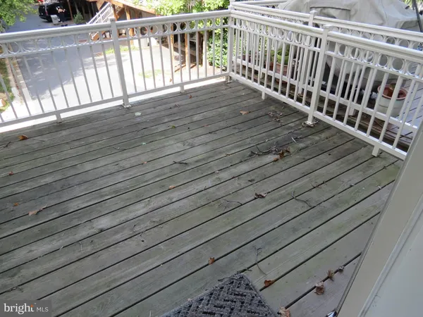 a view of balcony with wooden floor