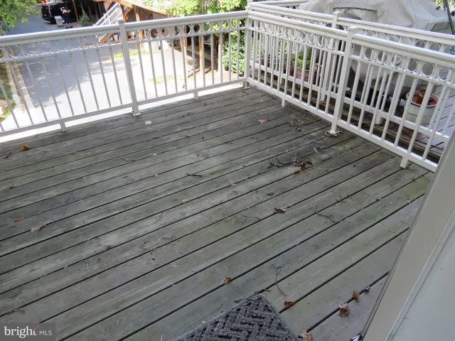 a view of balcony with wooden floor