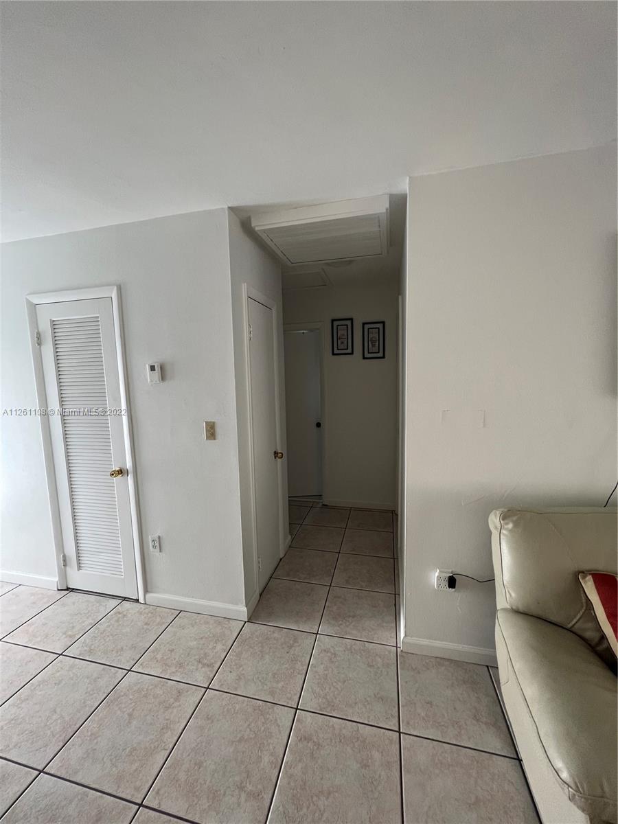 Kendale Lakes Miami, FL 33183 - Photo 12 of 26 a view of a hallway to rooms and stairs