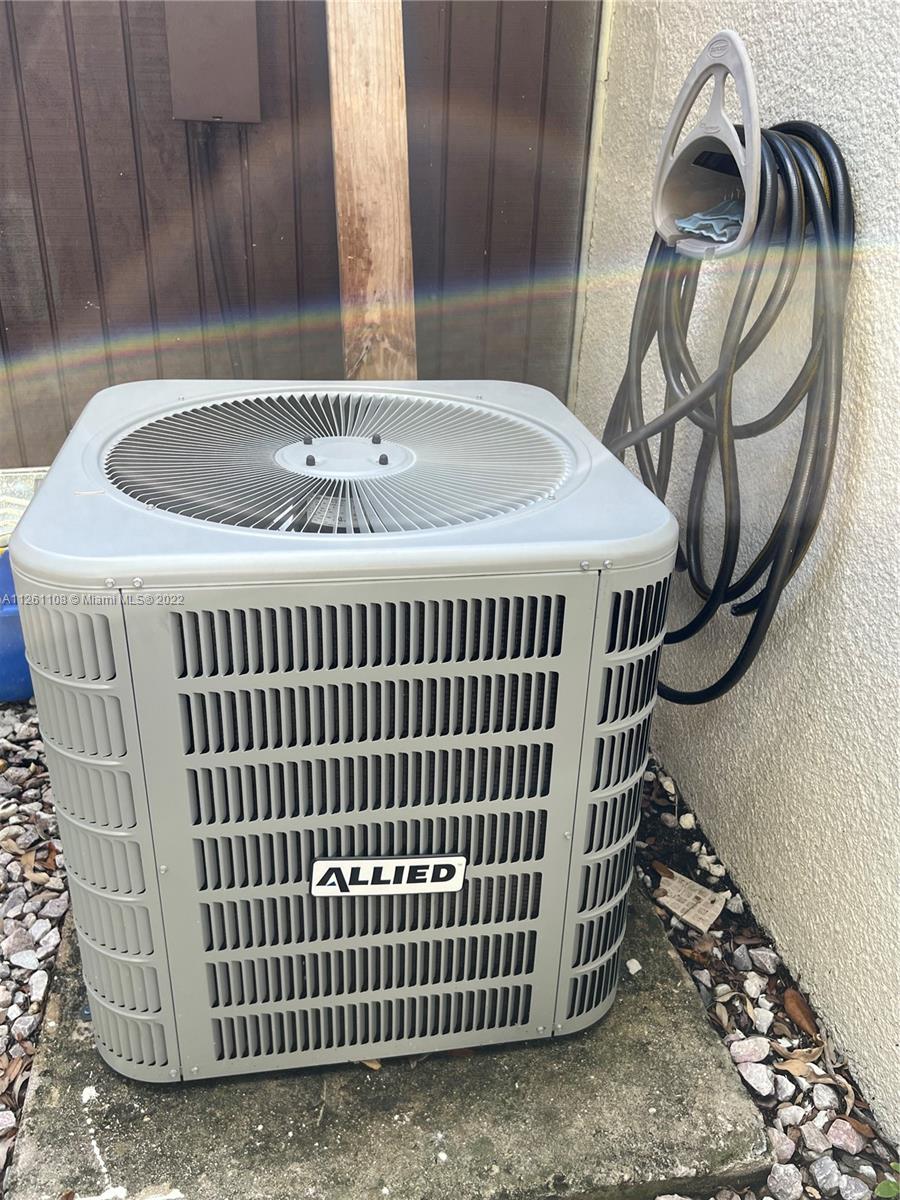 Kendale Lakes Miami, FL 33183 - Photo 22 of 26 a close view of a sink and a dishwasher with wooden floor