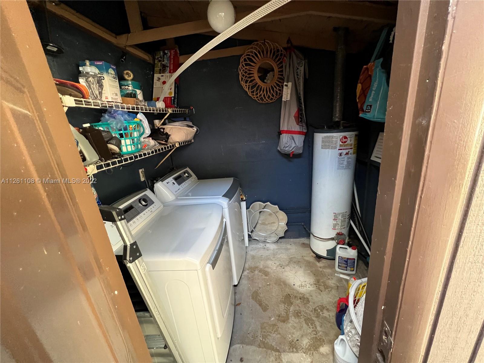 Kendale Lakes Miami, FL 33183 - Photo 24 of 26 a utility room with dryer and washer