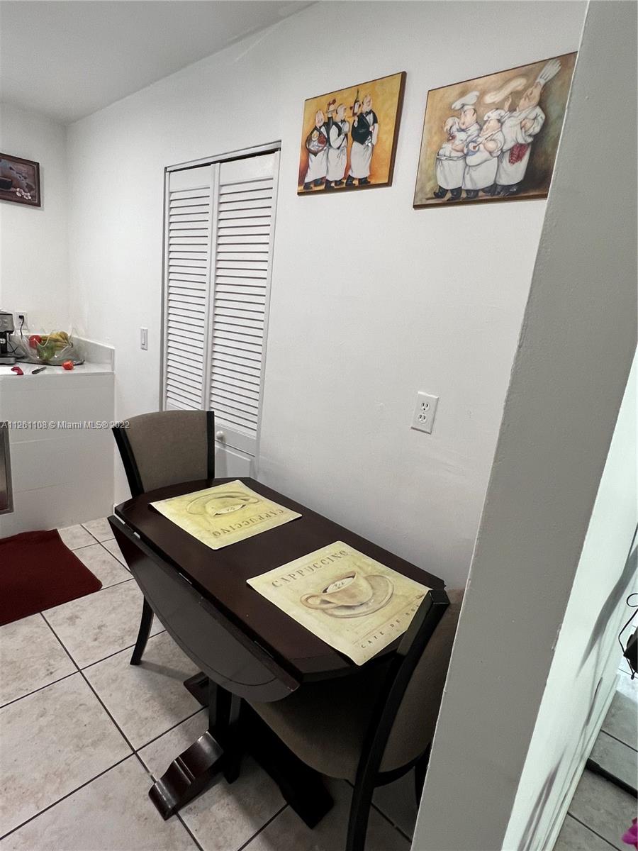 Kendale Lakes Miami, FL 33183 - Photo 9 of 26 a view of a workspace and a table in a room