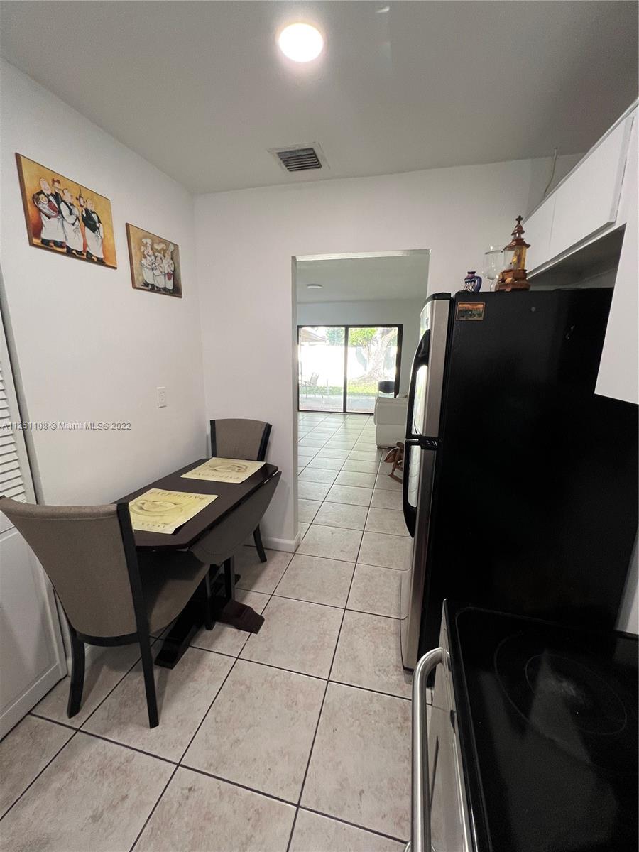 Kendale Lakes Miami, FL 33183 - Photo 10 of 26 a room with furniture and a fan