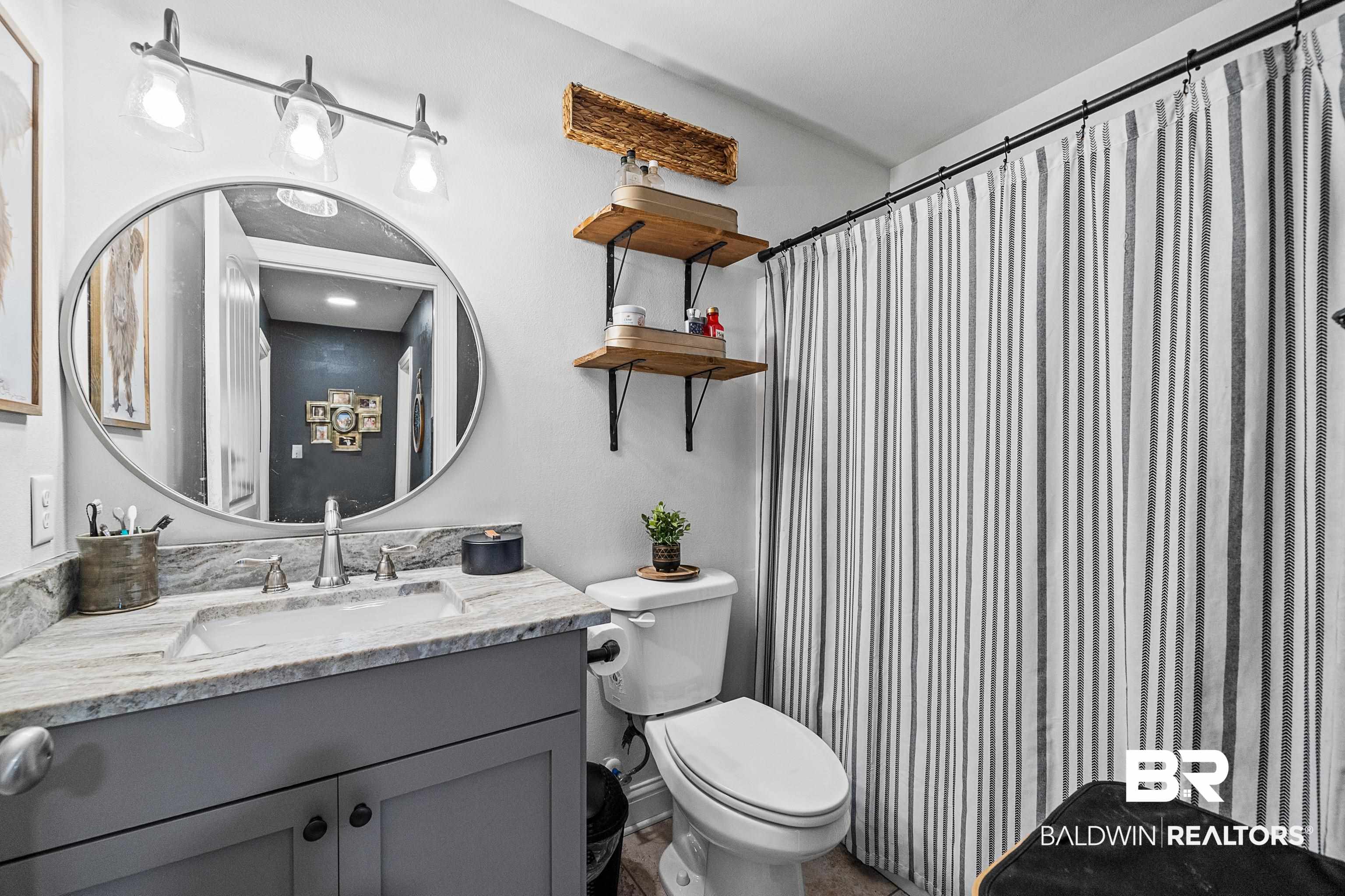 25212 Reeves Lane Elberta, AL 36530 - Photo 13 of 28 Full bath featuring vanity and a shower with shower curtain