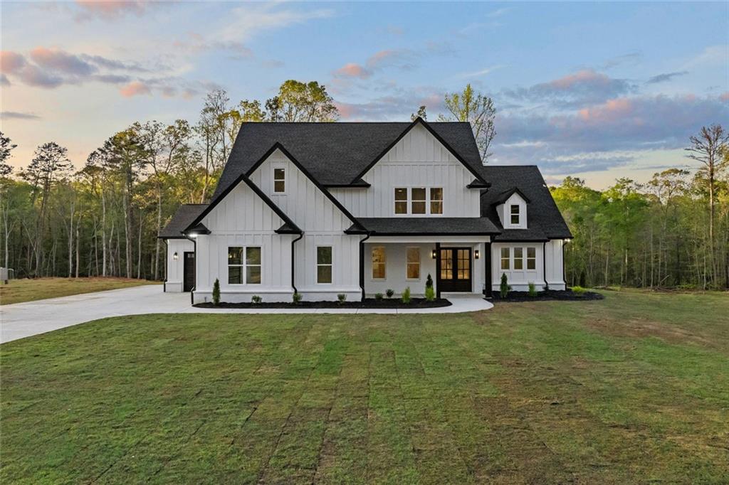 2100 Dry Pond Road Monroe, GA 30656 - Photo 1 of 1 a view of a house with a big yard and large trees