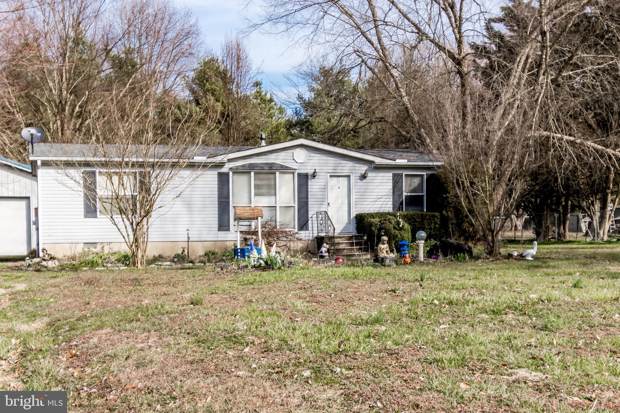2293 Fords Corner Road Hartly, DE 19953 - Photo 3 of 47 a view of house with a backyard and trees