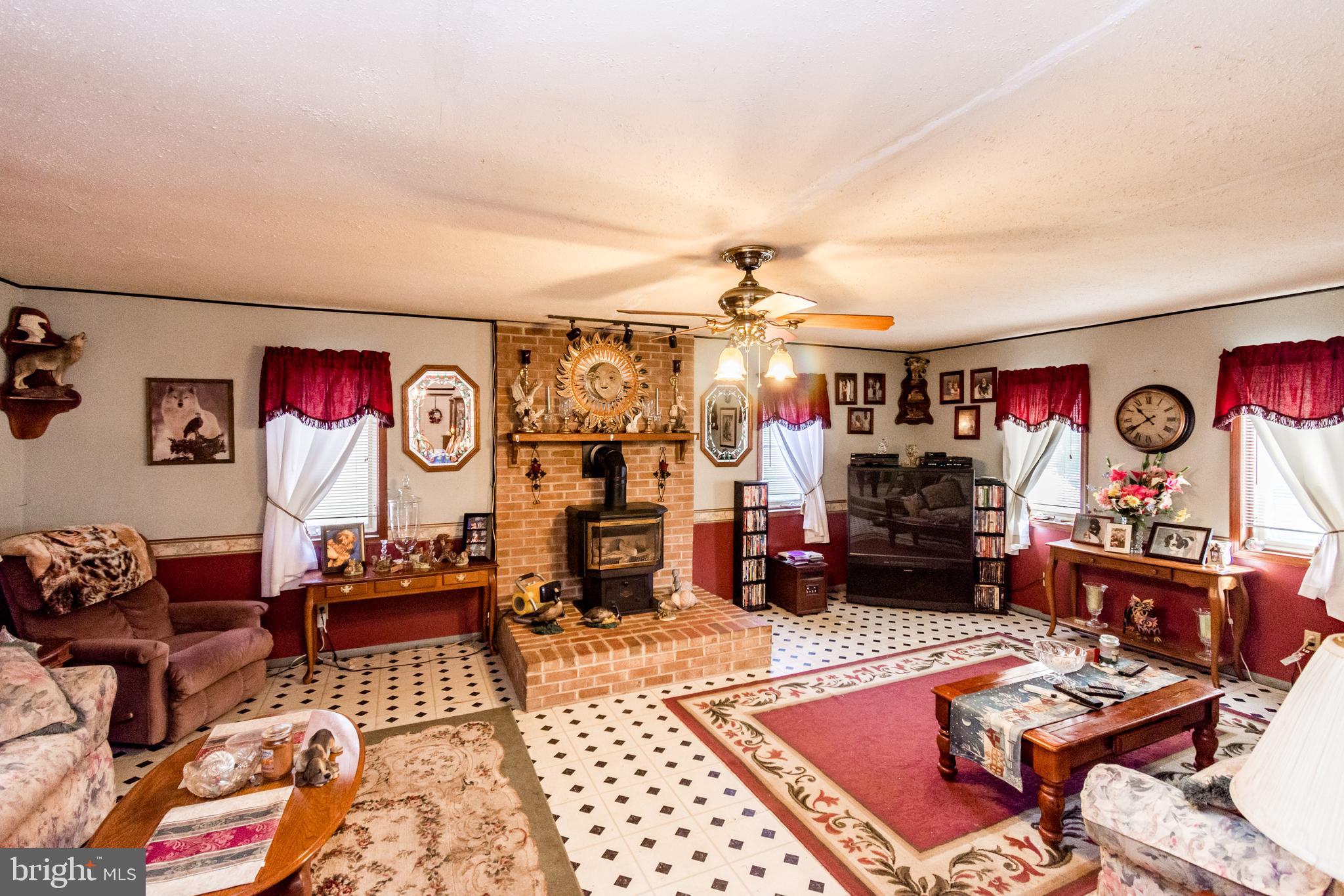 2293 Fords Corner Road Hartly, DE 19953 - Photo 21 of 47 a living room with lots of furniture and chandelier