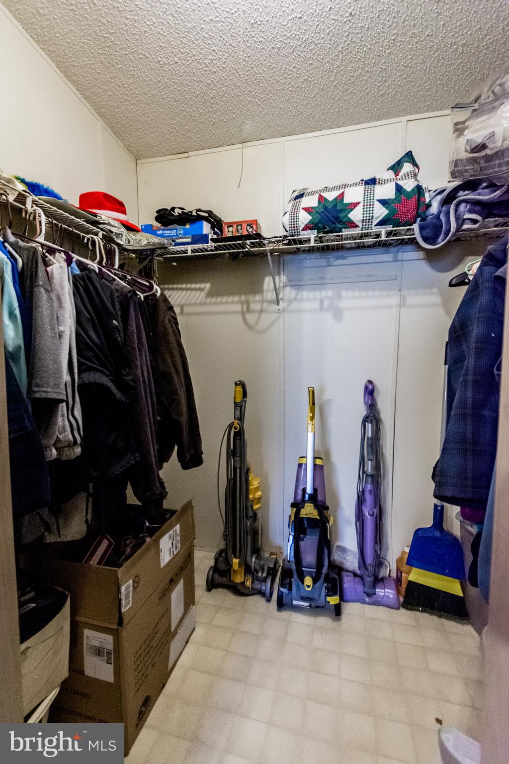 2293 Fords Corner Road Hartly, DE 19953 - Photo 38 of 47 a view of walk in closet with clothes and shoes
