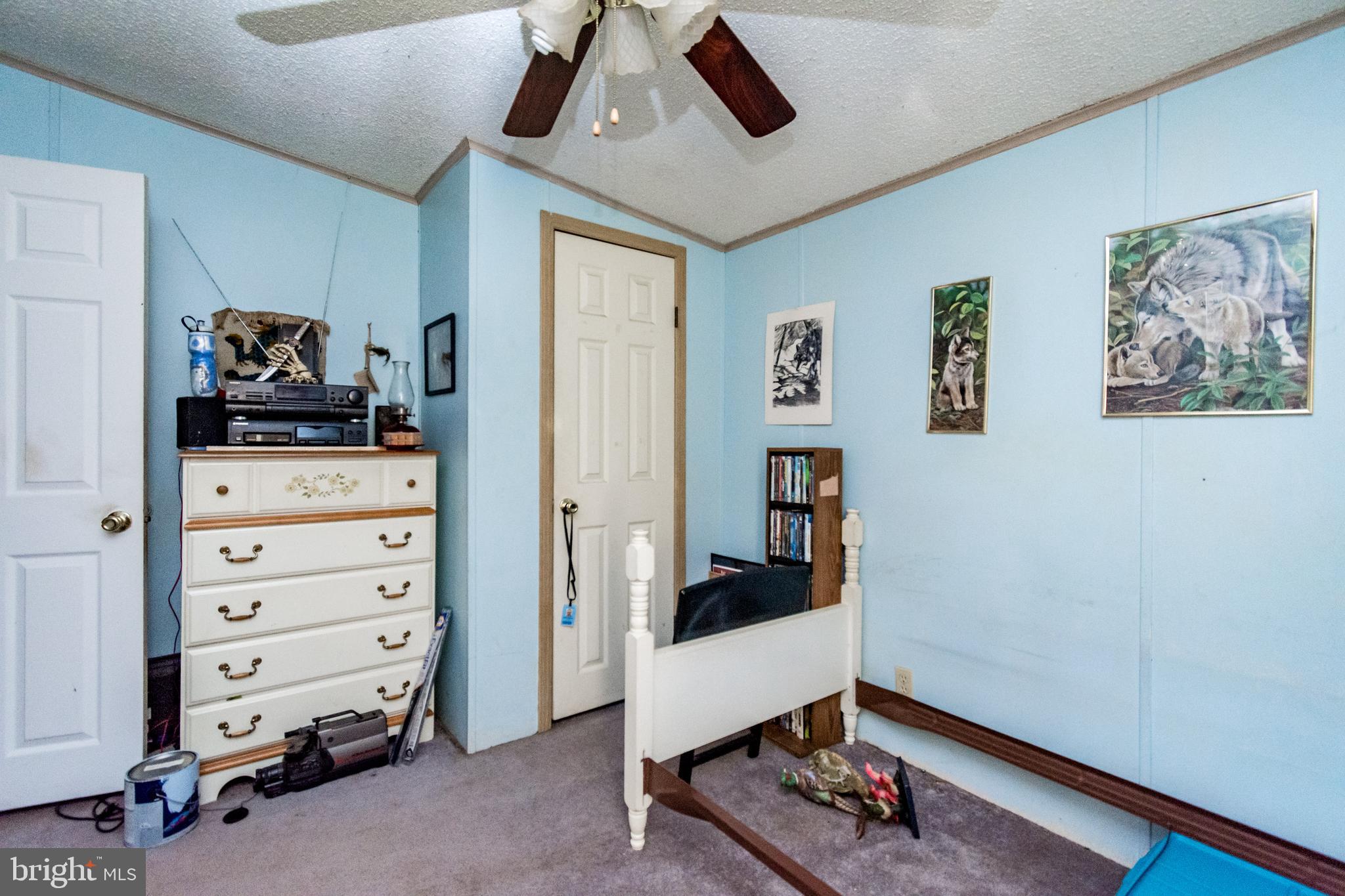 2293 Fords Corner Road Hartly, DE 19953 - Photo 40 of 47 a living room with furniture and paintings on the wall