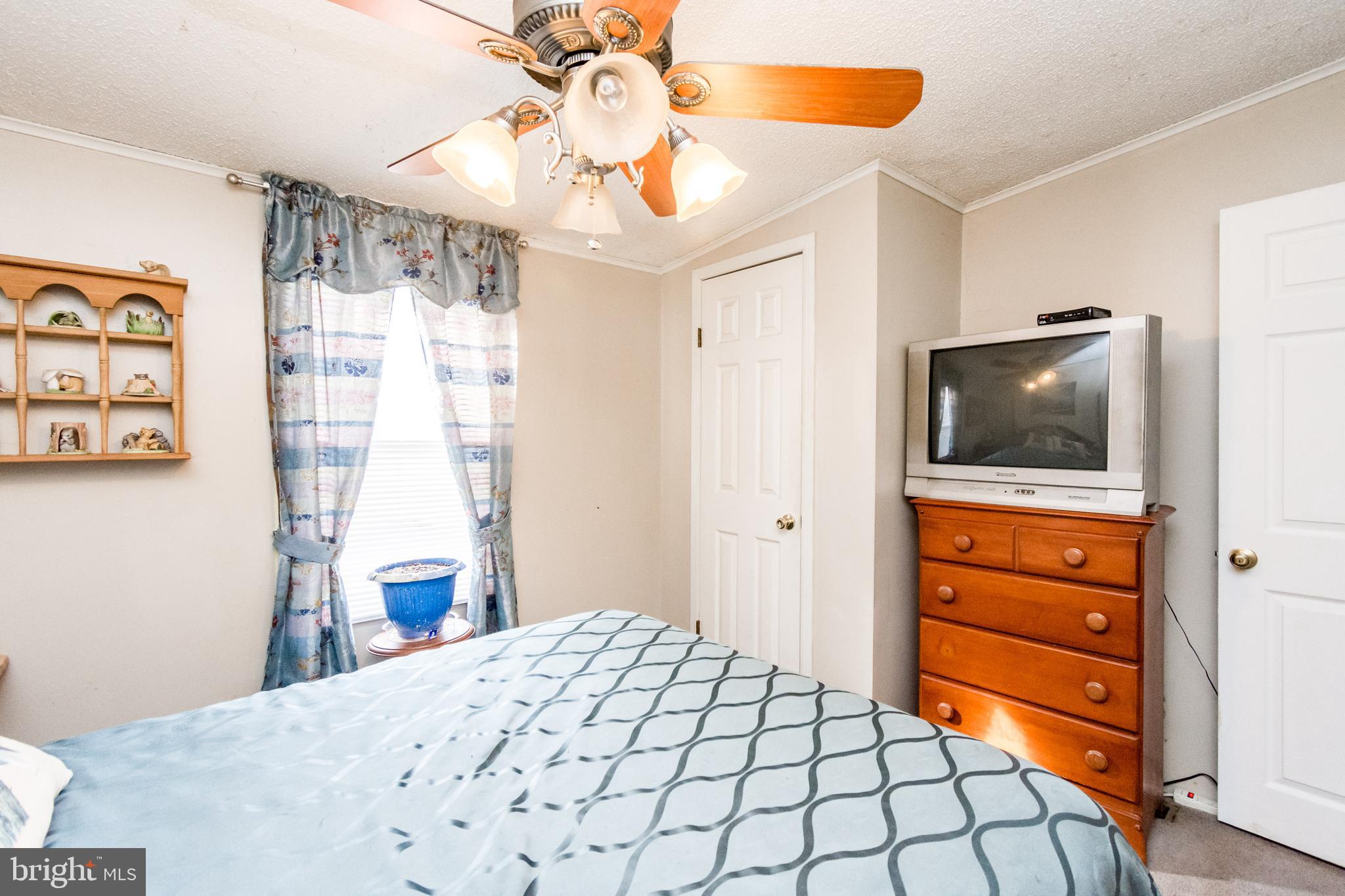 2293 Fords Corner Road Hartly, DE 19953 - Photo 45 of 47 a bedroom with a bed and a dresser