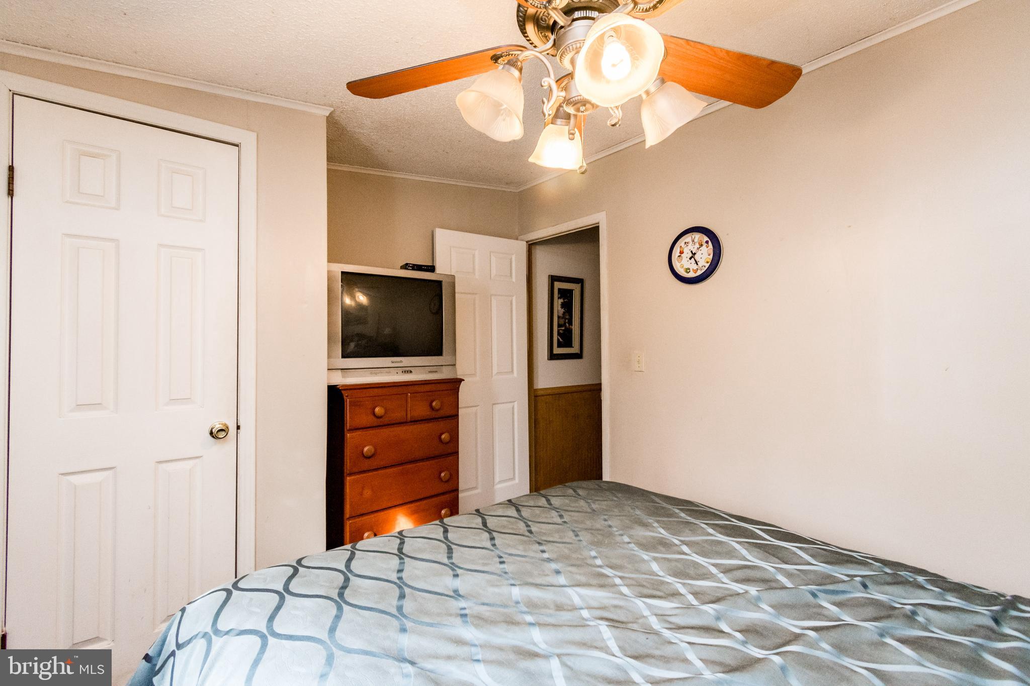2293 Fords Corner Road Hartly, DE 19953 - Photo 46 of 47 a room that has a bed and a television in it