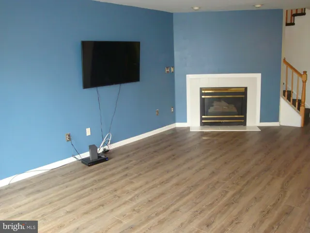 a view of a livingroom with wooden floor