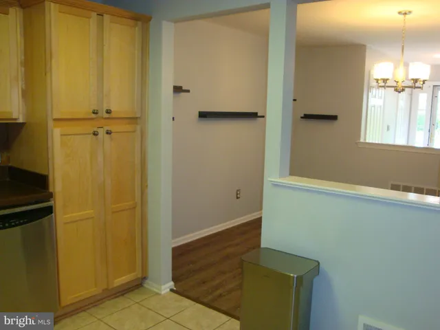 a kitchen with stainless steel appliances granite countertop a refrigerator a stove a sink and a microwave