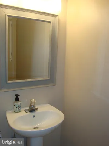 a bathroom with a shower and a sink
