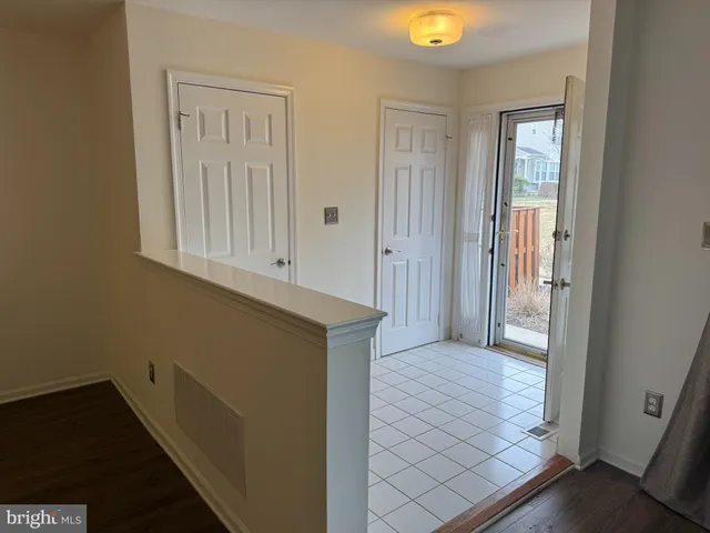 a kitchen with stainless steel appliances granite countertop a refrigerator a stove a sink and a microwave