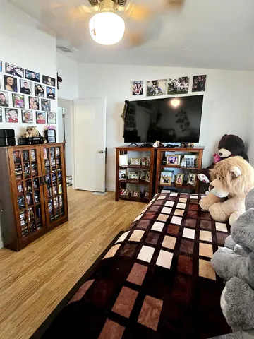 a room with furniture and flat screen tv