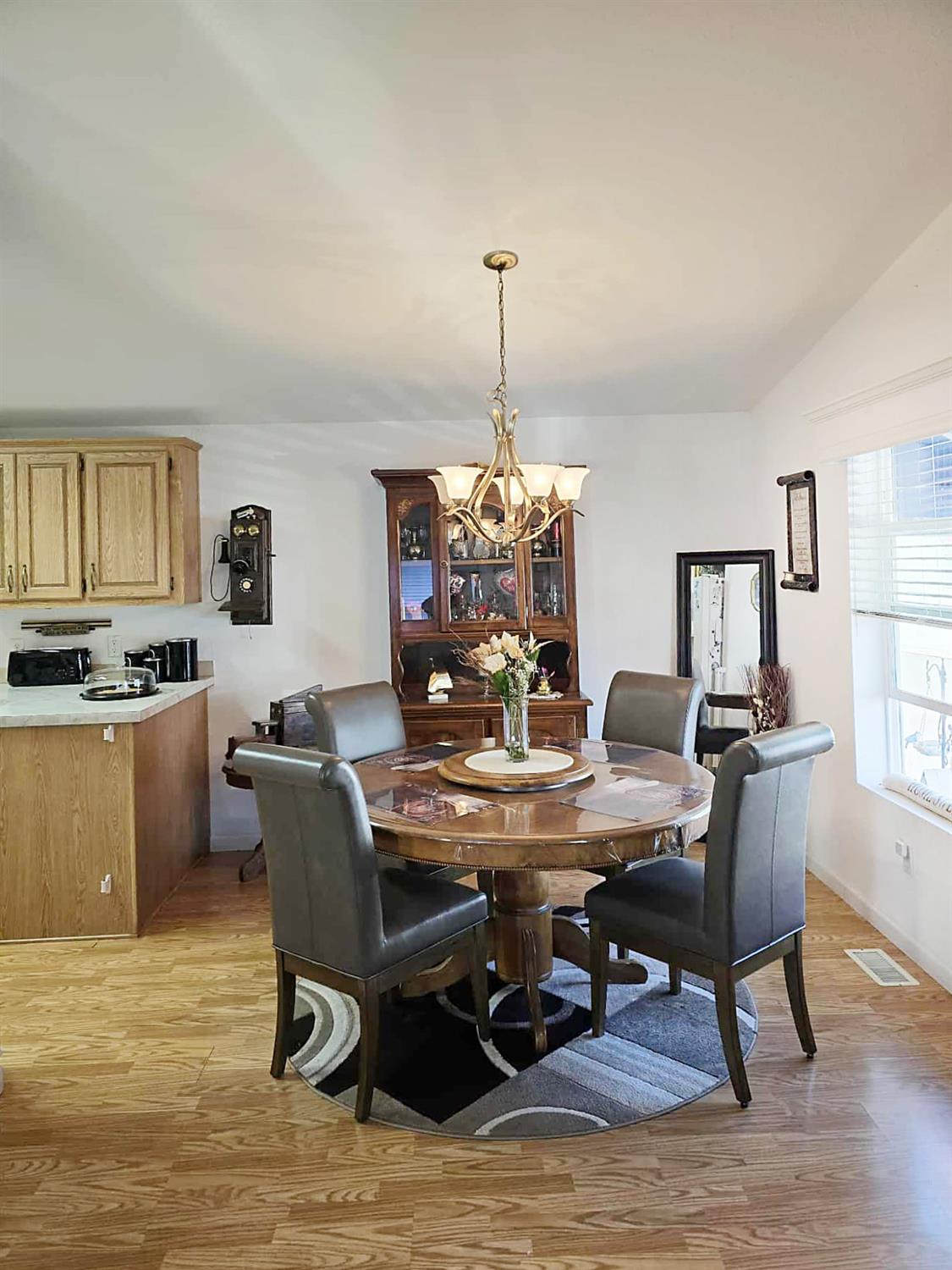 18717 Mill Villa Road, Unit 615 Jamestown, CA 95327 - Photo 9 of 19 a view of a dining room with furniture window and wooden floor