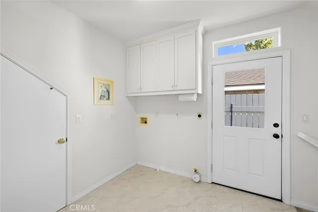 a view of a bedroom with furniture and book shelf