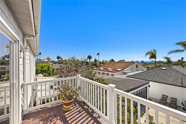 a view of a balcony with wooden fence and floor