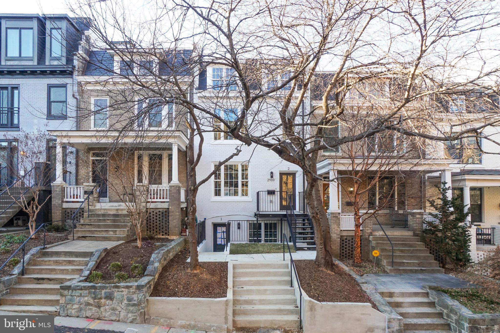 2910 18th Street Northwest Washington, DC 20009 - Photo 1 of 54 a front view of a building with trees